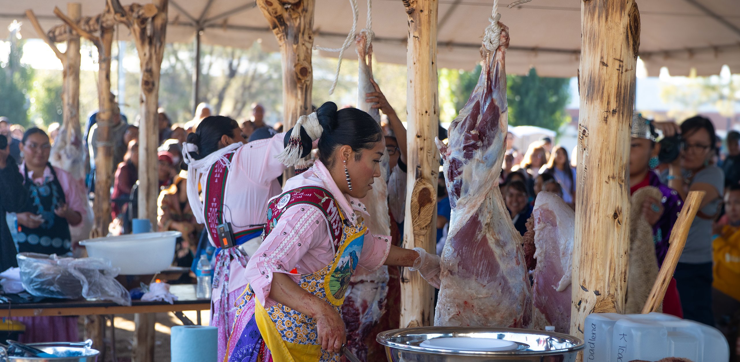 The Miss Navajo Nation contestants butcher sheep during the pageant’s first day in Window Rock on Sept. 1, 2024. (Photo by Brianna Chappie/Cronkite News)
