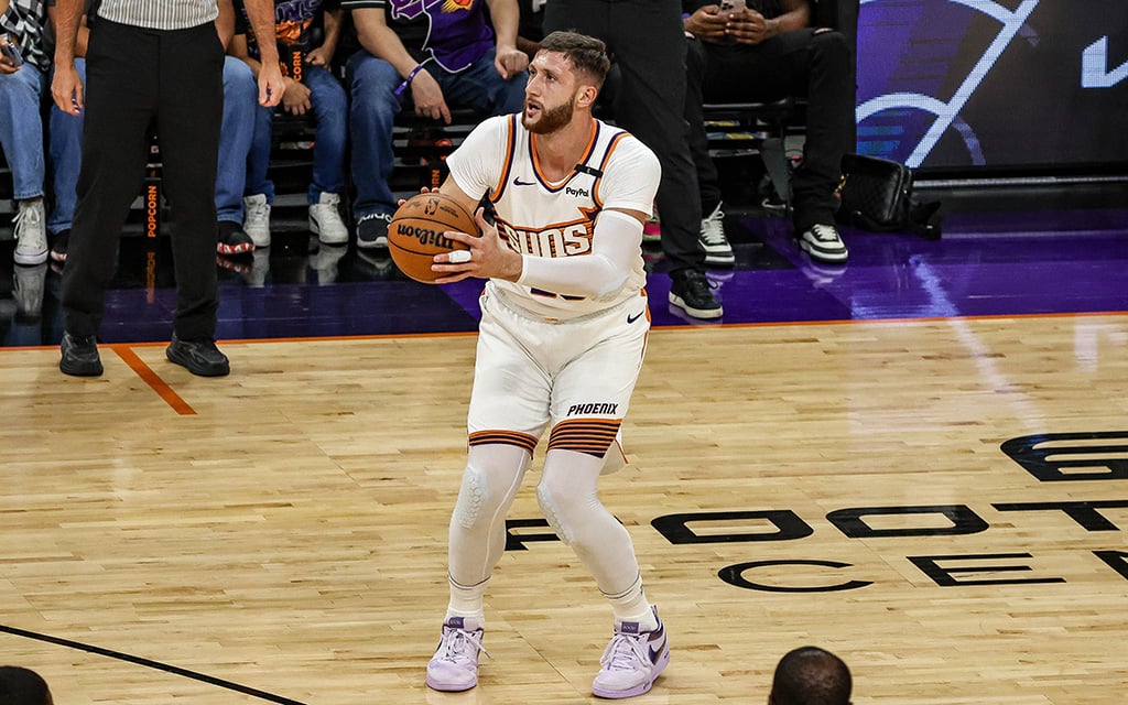 Phoenix Suns center Jusuf Nurkić steps into a 3-point shot