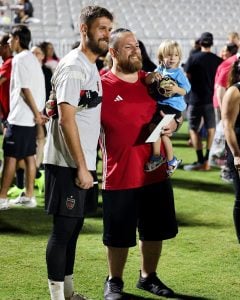 Phoenix Rising FC goalkeeper Patrick Rakovsky poses for photos with fans