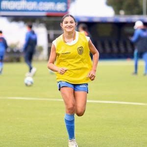 Caprice Chiuchiolo wearing her Ecuador national team penny