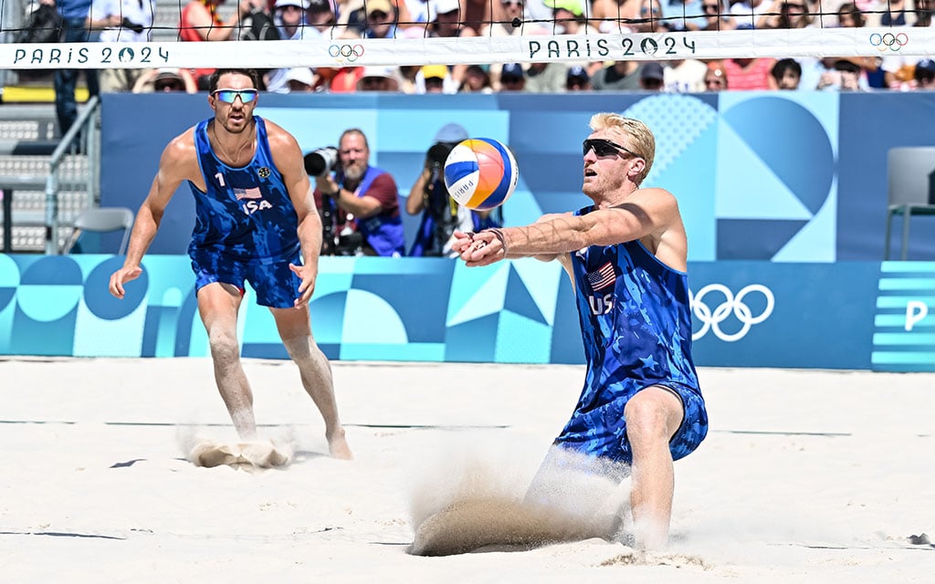 Chase Budinger and teammate in action during the Paris 2024 Olympics, wearing USA uniforms.