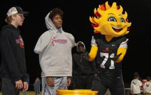 Westwood High School football players with the Fiesta Bowl mascot.