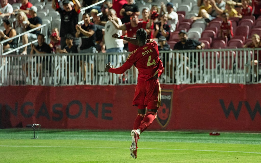 Phoenix Rising defender Pape Mar Boye celebrates towards Phoenix Rising fans.