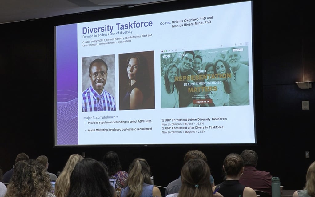 Presentation slide about the Diversity Taskforce, featuring headshots, accomplishments, and enrollment statistics.