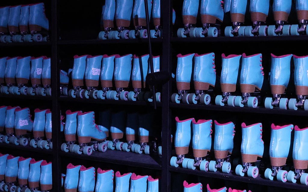 A wall full of turquoise and pink Impala skates are available to skaters at the Zoni Girls venue at the Arizona Center in downtown Phoenix. (Photo by Aryton Temcio/Cronkite News)