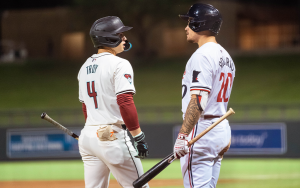 Two baseball players talk during play stoppage